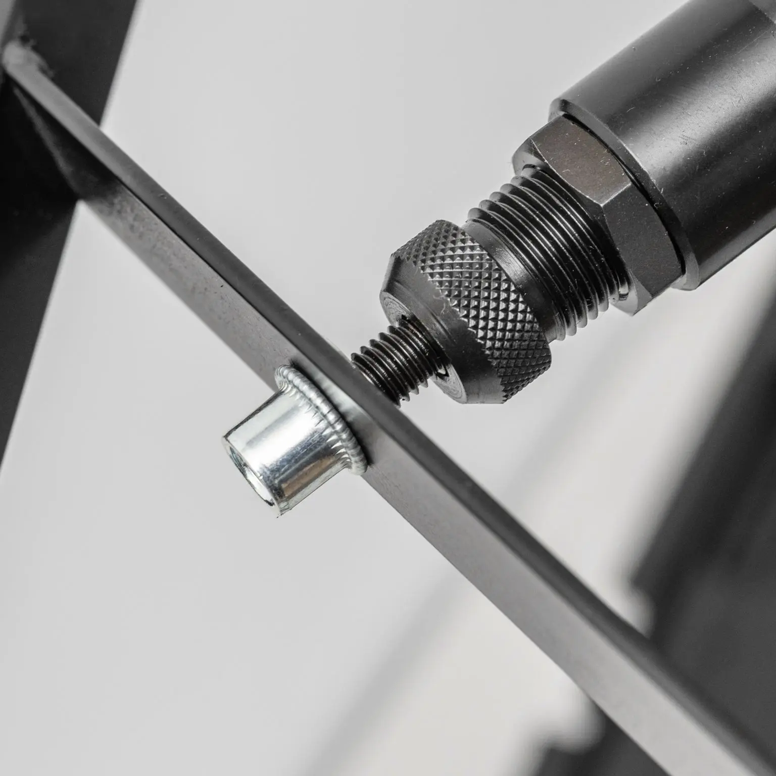 Supports single-sided installation without requiring access to the rear of the sheet metal